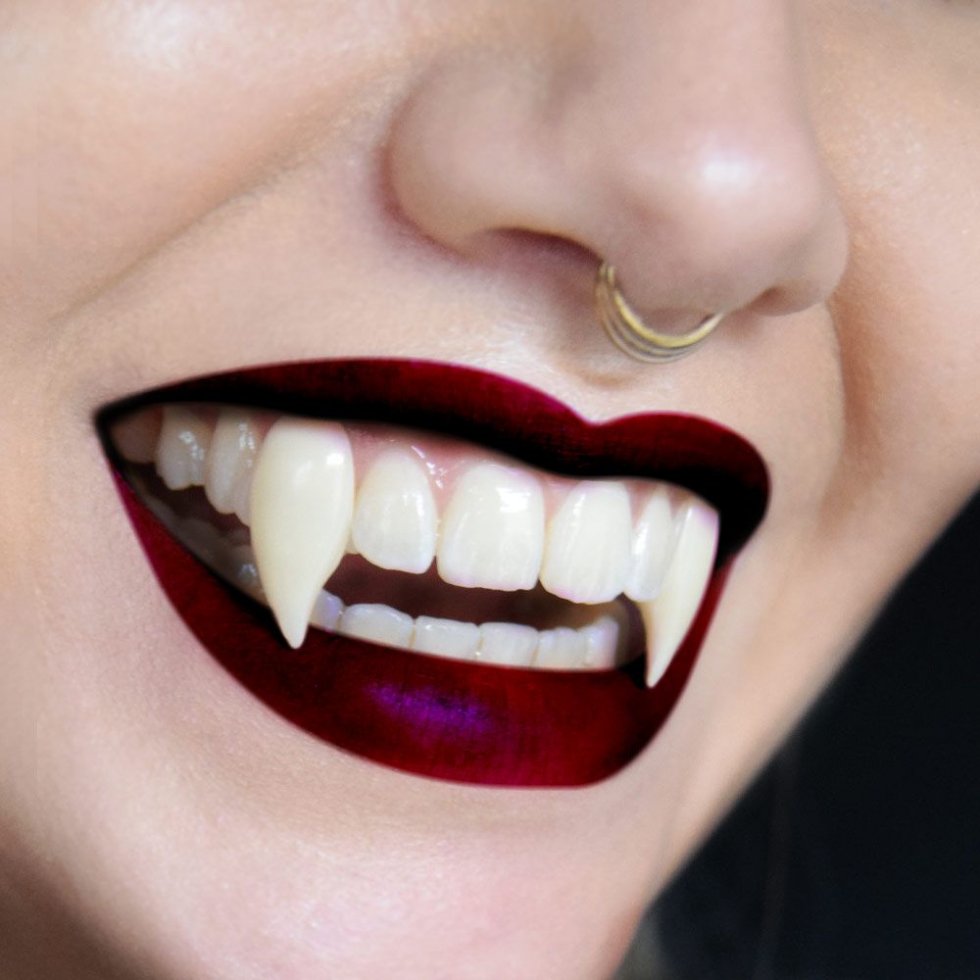 denti da vampiro per zanne da festa di Halloween